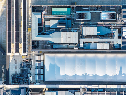 Aerial view of the Data Center at Oxford University featuring complex HVAC systems, solar panels, and a white membrane roof in Oxford, England, United Kingdom.
