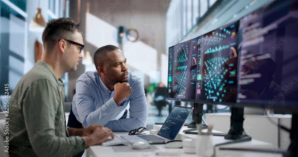 Obraz premium Data Scientist Carefully Analyzes AI Models Using Laptop