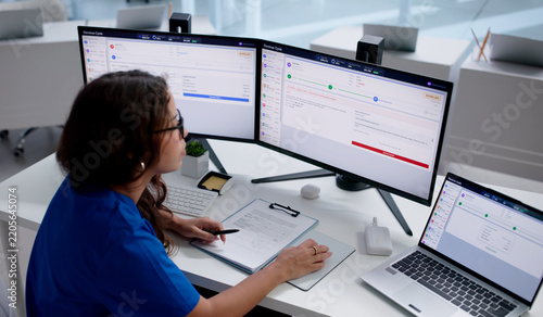 Healthcare Billing Specialist Carefully Reviews Patient Claims