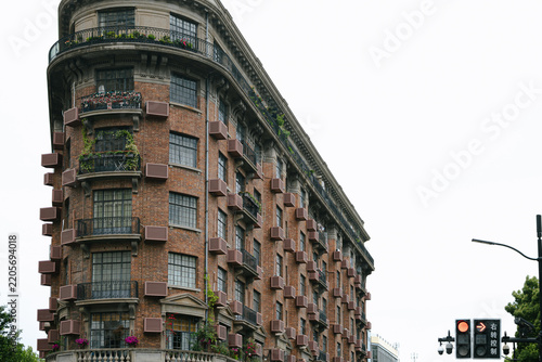 Photography Historic brick apartment building on a street corner
