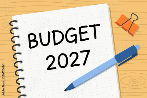 Budget planning notebook with pen and binder clip on wooden surface
