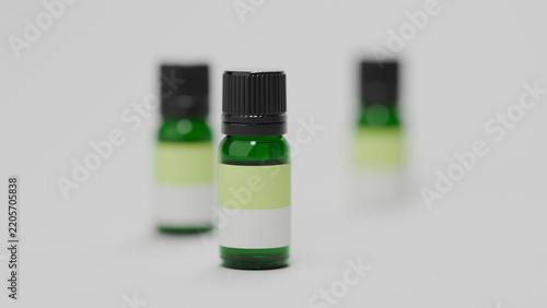 Three green glass essential oil bottles with shallow depth of field