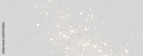 Glowing gold sparkles and bokeh particles drifting upwards. Luminous shimmering glitter overlay on transparent background