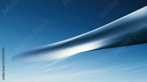 Wind turbine blade in motion against clear sky with transparent background for energy marketing
