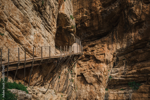 Elevated wooden boardwalk bolted to a sheer canyon wall at Caminito del Rey, Spain