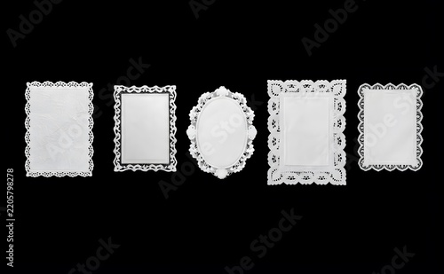 white lace paper doily with delicate elegant floral and scalloped frame with rectangular border desigm