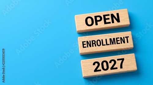 Open enrollment 2027 wooden blocks on vibrant blue background, healthcare insurance and employee benefits concept, education admission and registration banner, business planning copy space
