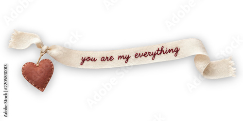 Fabric heart ornament on ribbon with text isolated on transparent background