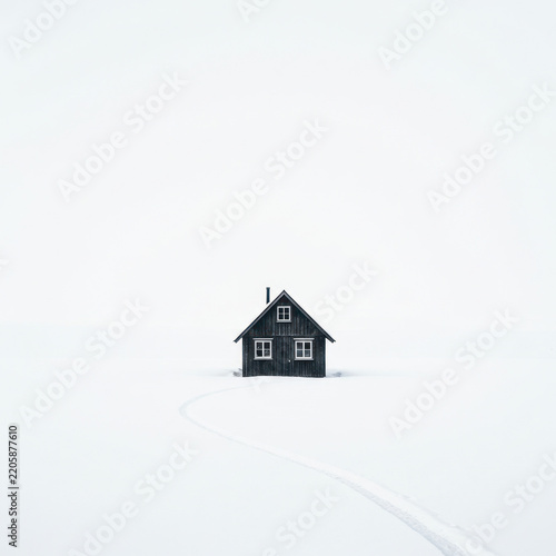 house in snow on white back griund