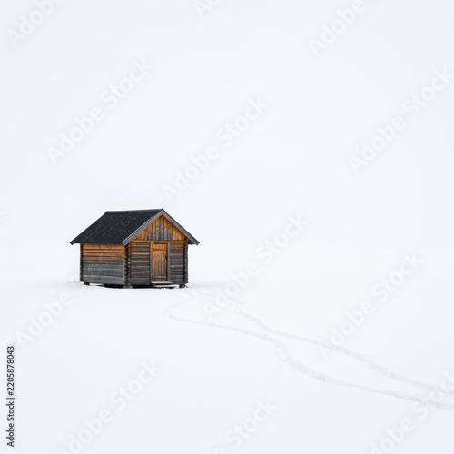 house in snow on white back griund