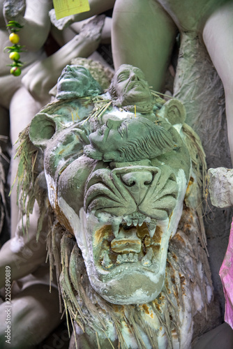 An unfinished clay idol of a roaring lion and the demon Mahishasura being handcrafted out of mud and straw in Kumartuli, Kolkata, ahead of the Hindu festival Durga Puja.