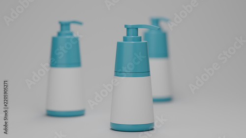 Blank teal soap pump dispenser bottle group of three, shallow depth of field