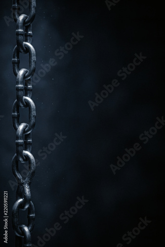 Heavy duty industrial chain hanging vertically with one cracked weak link on a dark blue background, supply chain tension, concept
