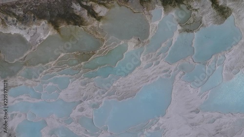 Aerial view of breathtaking natural site of white travertine thermal terraces, Pamukkale, Türkiye	
