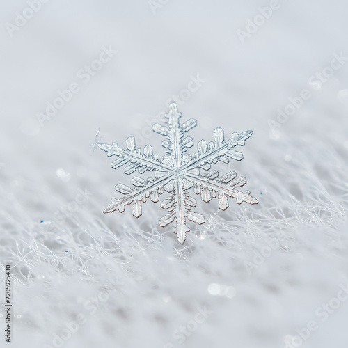 christmas snowflake on snow on white background