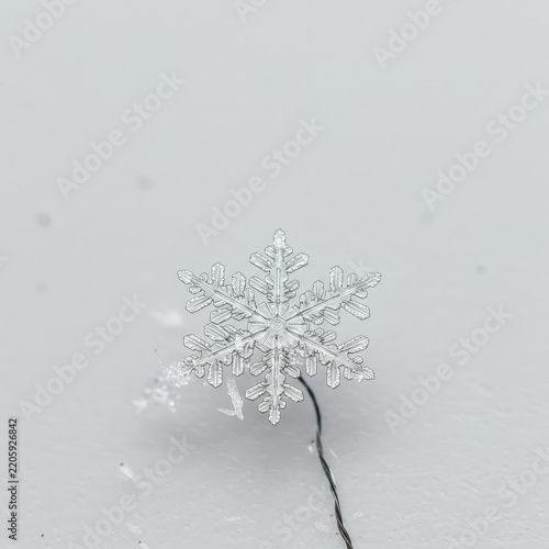 christmas snowflake on snow on white background