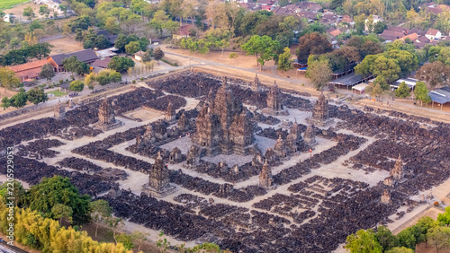 Aerial view of Sewu Temple, an ancient Buddhist temple complex with a central shrine surrounded by rows of smaller stupas, set in Kecamatan Prambanan, Jawa Tengah, Indonesia.