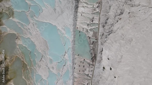 Aerial view of breathtaking natural site of white travertine thermal terraces, Pamukkale, Türkiye	
