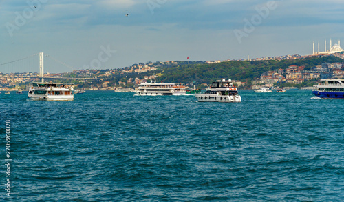 Panoramic view of Bosphorus strait with boats and Hagia Sophia in Istanbul, Turkey