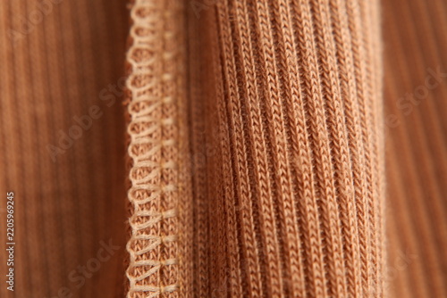 Fotografie Close-up of warm orange brown knitted fabric texture background