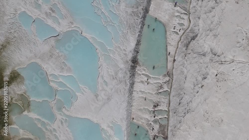 Aerial view of breathtaking natural site of white travertine thermal terraces, Pamukkale, Türkiye	
