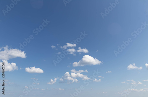 Sky replacement blue sky and spotty white clouds