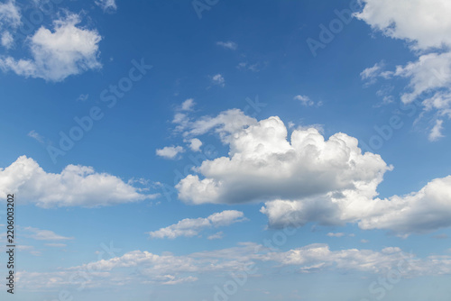 Sky replacement blue sky and puffy white clouds