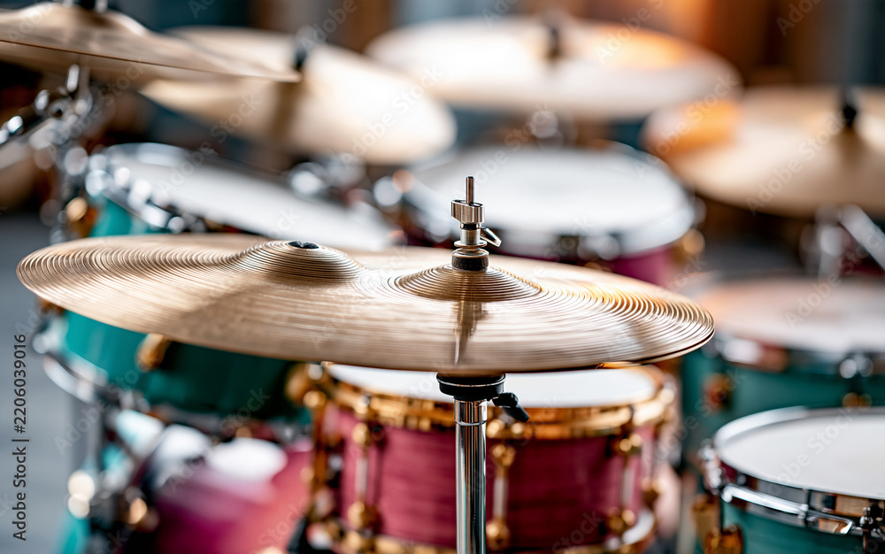 Obraz premium a drum kit in a music studio, cymbals catching light, colorful drum shells, soft studio lighting