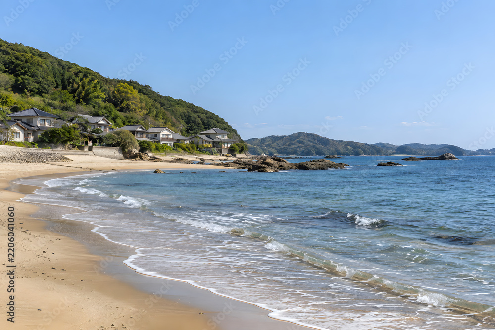 Fototapeta premium Quiet Beach Beside a Rural Japanese Coastal Village