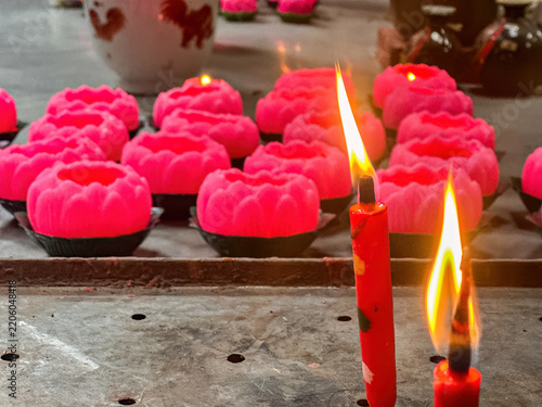 Obraz na plátně Lit Candles in a Taoist Temple, Kuala Lumpur, Malaysia