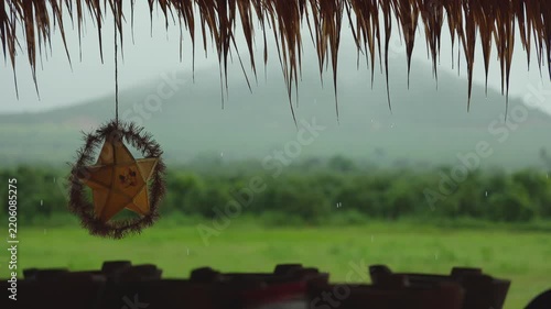 Rainy Countryside Landscape with Green Fields and Dark Cloudy Sky