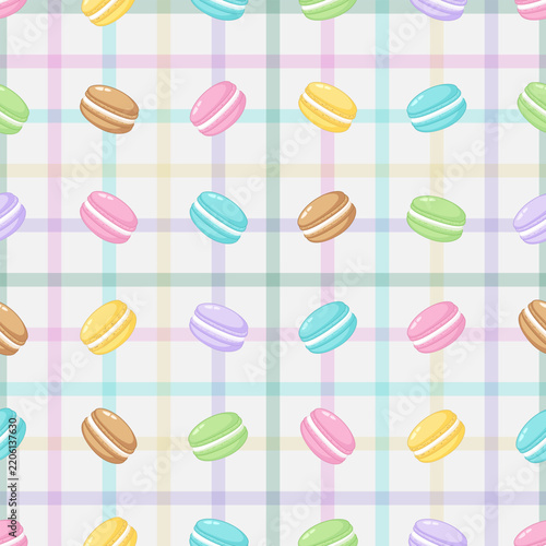 Seamless pattern of colorful macarons in soft pastel colors, arranged over a soft plaid grid background.
