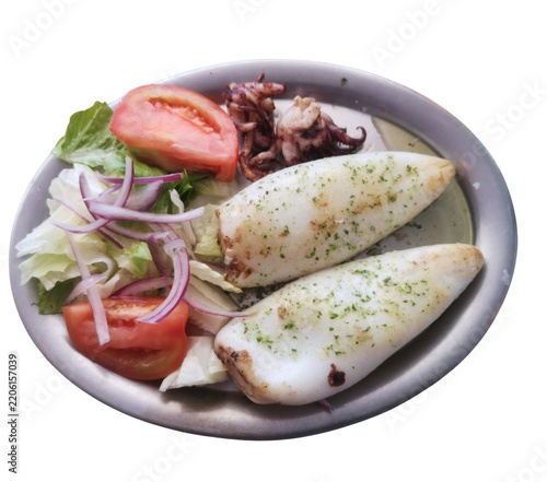 Grilled squid calamari seafood dish with fresh salad