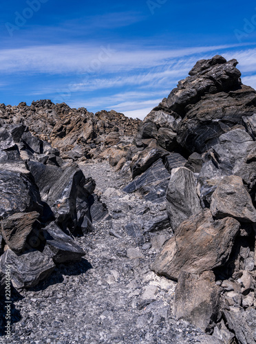 Jagged obsidian lava flow and volcanic rock formations in the Big Obsidian Flow area of Newberry National Volcanic Monument, Deschutes County, Oregon.