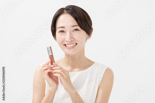 Cuadro en lienzo 化粧品を持つ女性