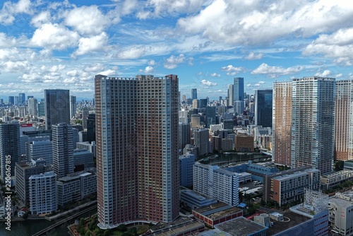 Aerial drone photo of skyscrapers and waterway in Minato, Tokyo, Japan