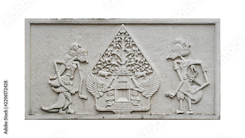 Traditional Javanese Wayang Relief Carving on White Wall Background
