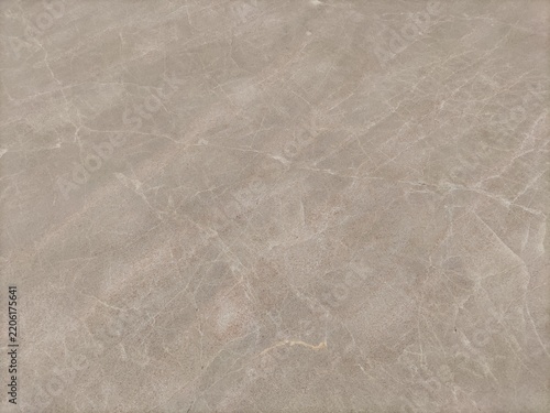 Fotografie Smooth taupe marble stone texture ideal for backgrounds, interior design, architectural projects, luxury packaging, and natural stone product branding