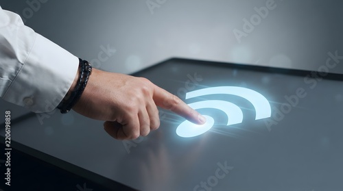  Finger Tapping Glowing Wireless Signal Icon on Futuristic Touchscreen Display