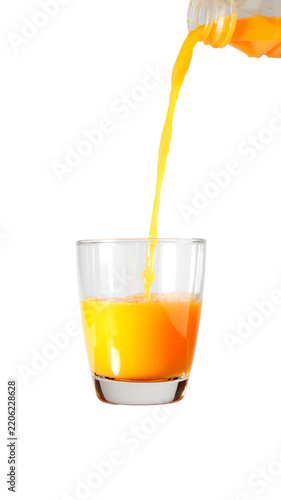 Fresh Orange Juice Being Poured Into a Clear Glass on White Background