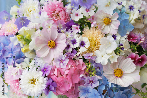 Beautiful bouquet of phlox, asters, hydrangeas, cosmos flower and bellflowers, closeup, blur effect, selective focus.