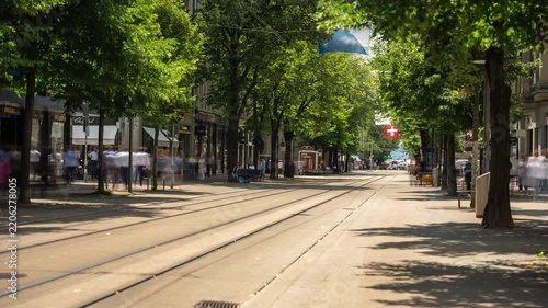 Zurich Bahnhofstrasse street timelapse of moving shadows and shifting sunlight across historic shopping avenue with tram tracks