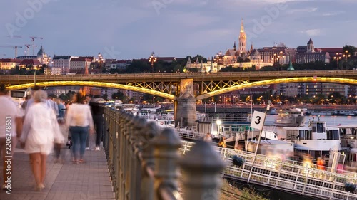 Budapest Margaret Bridge timelapse with illuminated skyline at dusk over the Danube river and glowing city lights