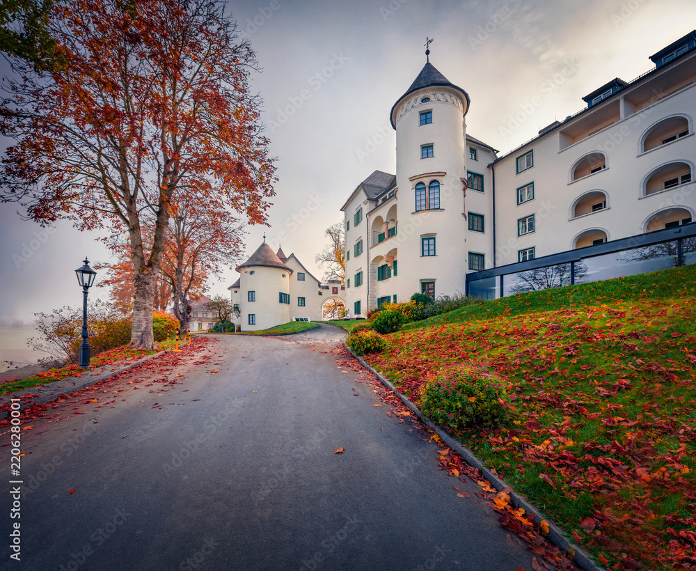 Obraz premium Captivating morning view of Pichlarn Castle, situated on an elevation in the Ennstal valley in Styria. Spectacular autumn cityscape of Pichlarn resort, Austria.