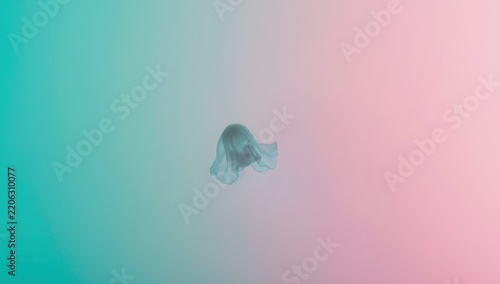 Ghost silhouette floating in ethereal gradient background, minimalist supernatural concept with soft pastel teal and pink lighting