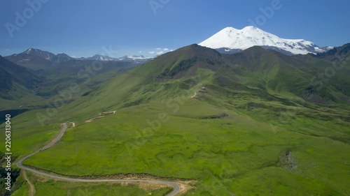 A beautiful view of the snow-capped peaks of Mount Elbrus (elevation 5,642 m). The landscape and nature of the North Caucasus.