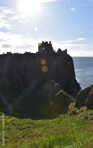 Moody Seascape with Medieval Fortress Silhouette in Scotland