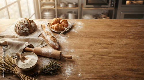 Artisan bakery items with bread and croissants on a rustic wooden workbench