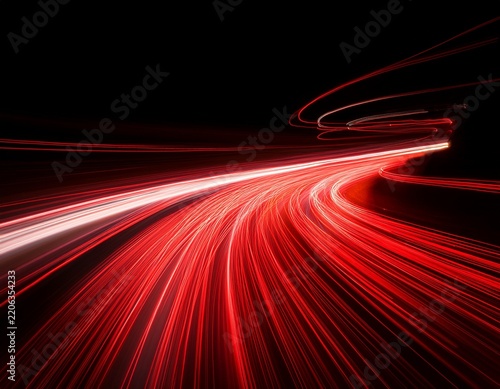 the effect of red light in fast motion on a black background blurred abstract background with long exposure neon light