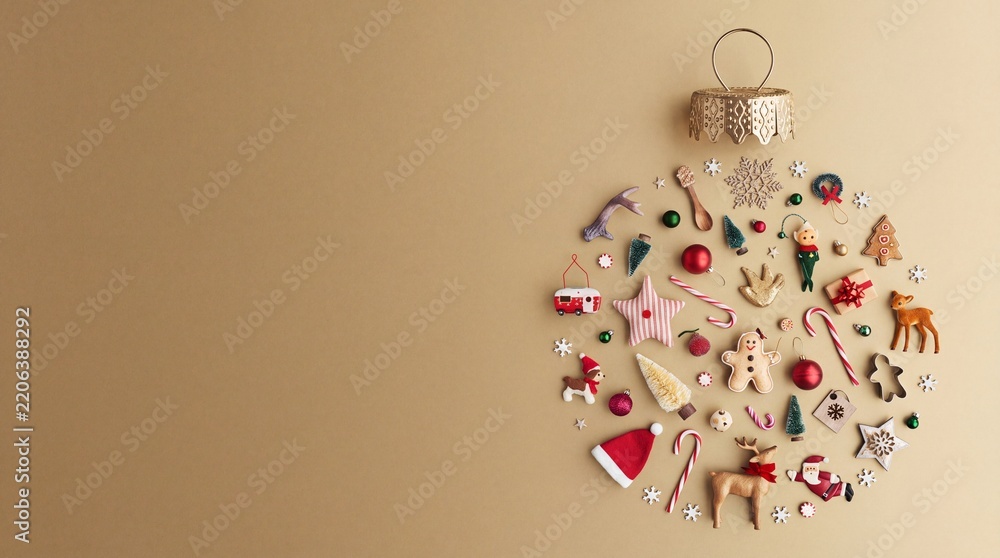 Obraz premium Creative Christmas Bauble Concept Made of Various Festive Ornaments and Trinkets Arranged in a Circle on a Beige Background with Copy Space, Flat Lay Minimalist Holiday Season Decoration.